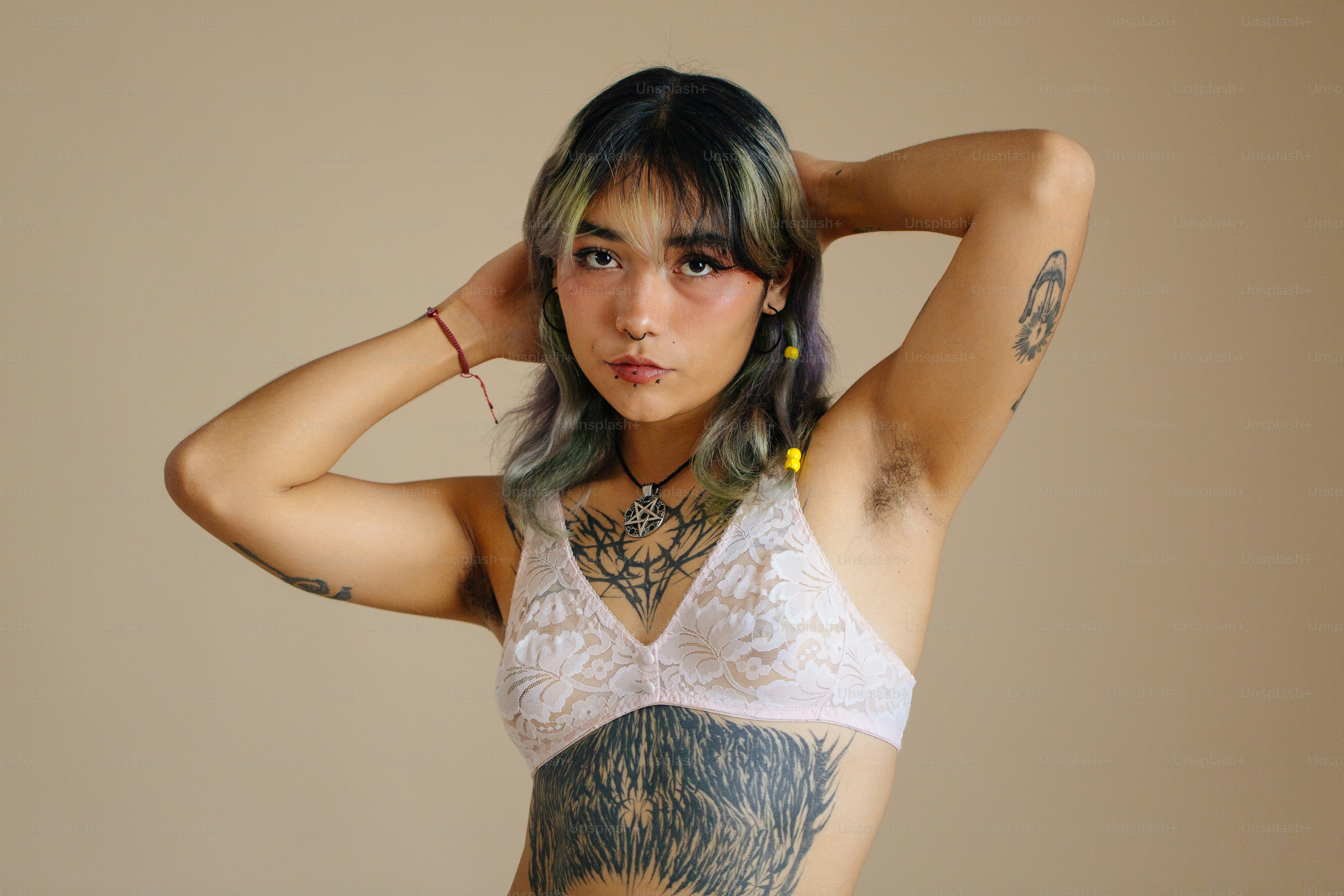 a woman with a tattoo on her arm